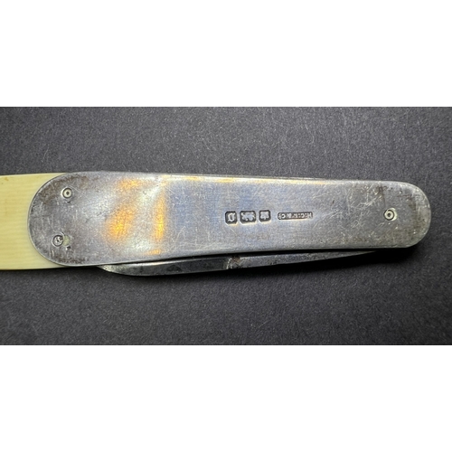 688A - A vintage Advertising 'The Motor' letter opener with hall marked silver handle and ivorine blade