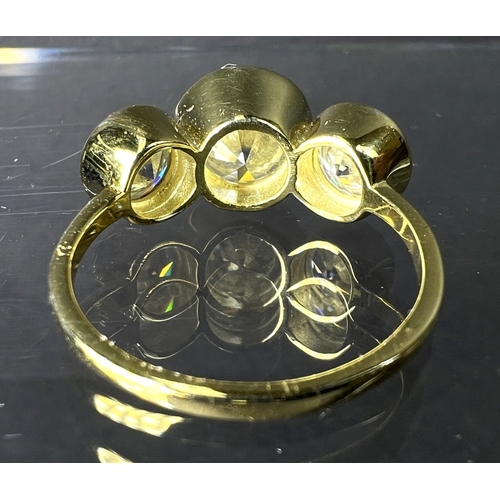 689 - A modern dress ring with 3 large moissanite stones (approx. 4ct total) in gold plated setting stampe... 