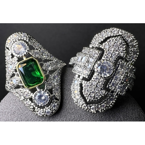 690 - Two Art Deco style costume diamanté dress rings; a silver tone diamanté necklace