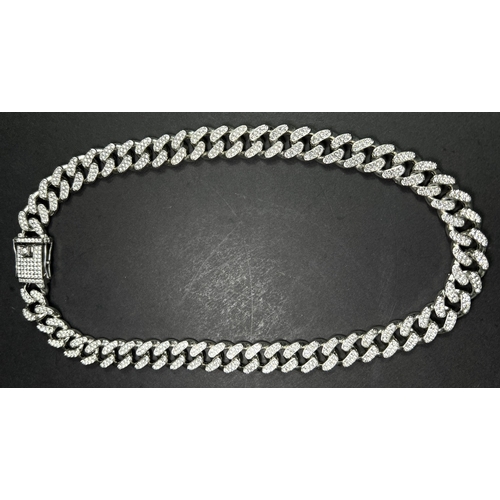 690 - Two Art Deco style costume diamanté dress rings; a silver tone diamanté necklace