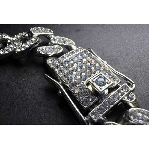 690 - Two Art Deco style costume diamanté dress rings; a silver tone diamanté necklace