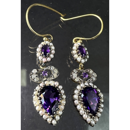 691 - A pair of Victorian style pendant earrings set with pear shape amethyst and seed pearls to lower dro... 