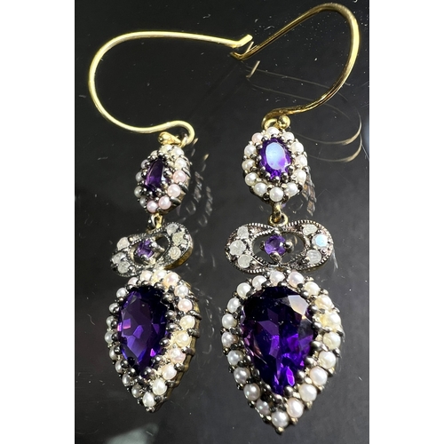 691 - A pair of Victorian style pendant earrings set with pear shape amethyst and seed pearls to lower dro... 