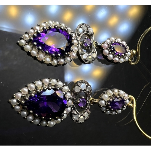 691 - A pair of Victorian style pendant earrings set with pear shape amethyst and seed pearls to lower dro... 