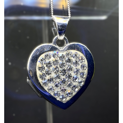 699 - A 9ct gold heart shaped locket set with crystals on chain