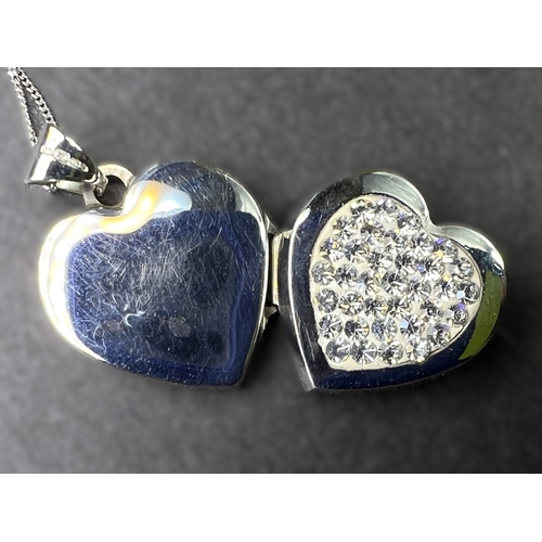 699 - A 9ct gold heart shaped locket set with crystals on chain