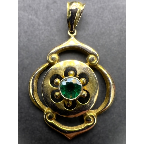 700 - An Edwardian 9ct gold pendent set with green stone, possibly tourmaline.  1.6gms