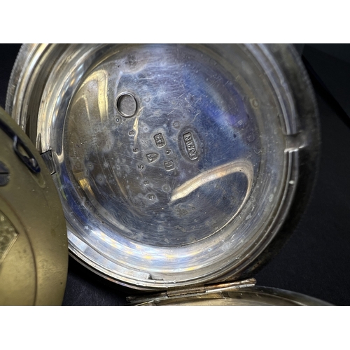 712 - Two silver cased open faced pocket watches and a vintage stopwatch