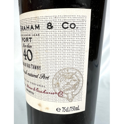726 - A 75cl bottle of W & J Graham's Port - More Than 40 Years of Age Tawny, in wooden presentation b... 