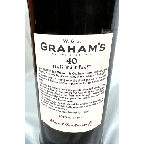 726 - A 75cl bottle of W & J Graham's Port - More Than 40 Years of Age Tawny, in wooden presentation b... 