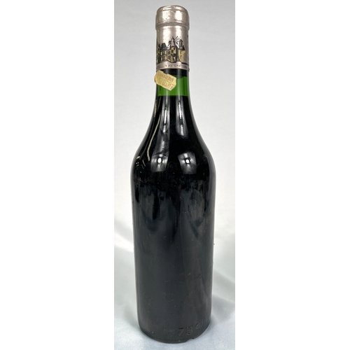 730 - A bottle of Chateau Haut Brion Premier Cru 1975 (label torn)
