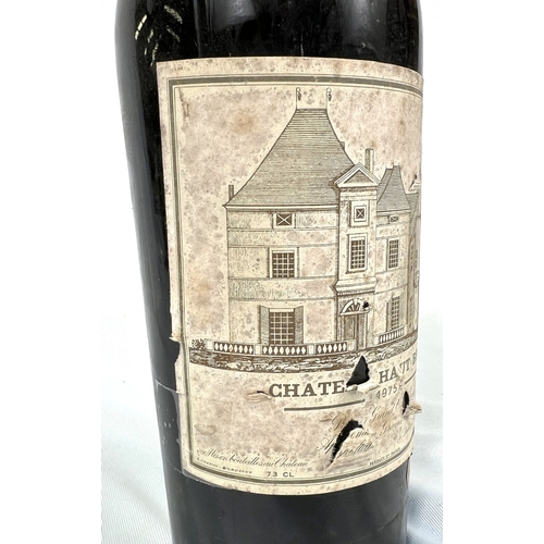 730 - A bottle of Chateau Haut Brion Premier Cru 1975 (label torn)