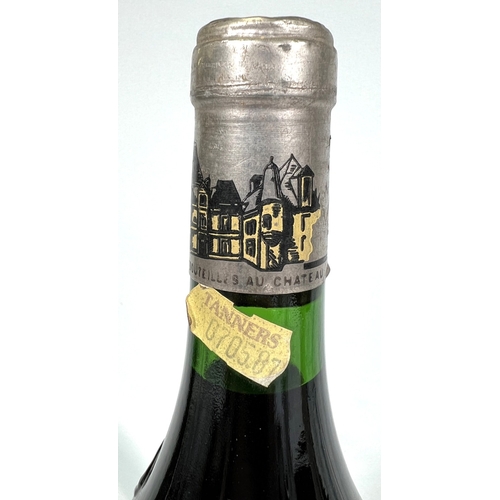 730 - A bottle of Chateau Haut Brion Premier Cru 1975 (label torn)