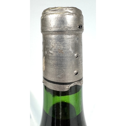 730 - A bottle of Chateau Haut Brion Premier Cru 1975 (label torn)