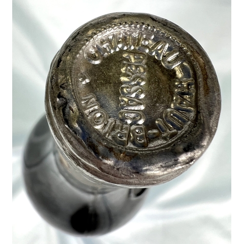 730 - A bottle of Chateau Haut Brion Premier Cru 1975 (label torn)