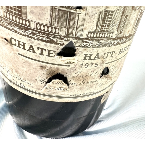 730 - A bottle of Chateau Haut Brion Premier Cru 1975 (label torn)