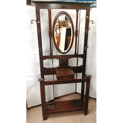 795 - Oak hall stand with adjustable mirror and original coat hooks, width 93cm, depth 33cm height 195cm; ... 