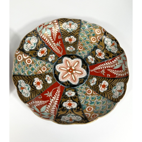 551 - A 19th century Japanese Imari porcelain dish of scalloped form, 22cm, and a similar dish decorated w... 