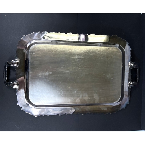 614 - A large silver plated tray with grapevine border and double handles, 64cm