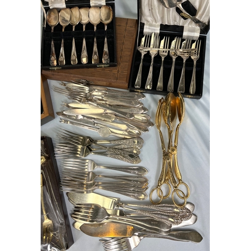 668 - A collection of boxed and loose cutlery.
