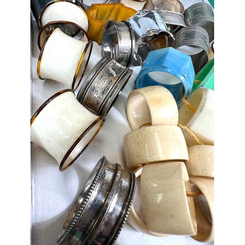 670 - A collection of silver, white metal and other napkin rings.