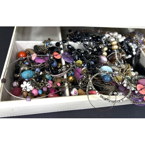 701 - A stacking jewellery box in white with items of costume jewellery