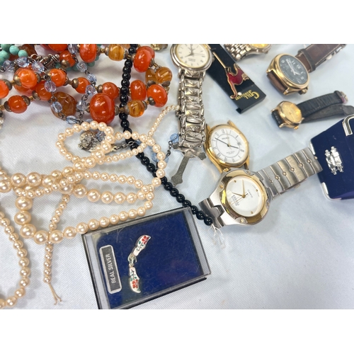 704 - A collection of watches, costume beads etc
