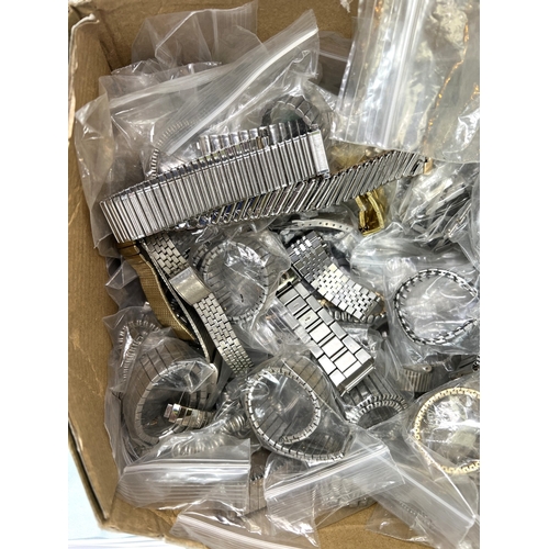 705B - A collection of unused watch straps, metal etc