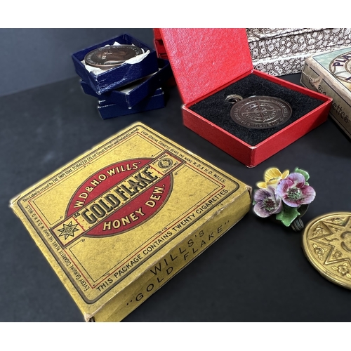 711 - A collection of post war Small holding medals bronze, costume, cigarette cards etc
