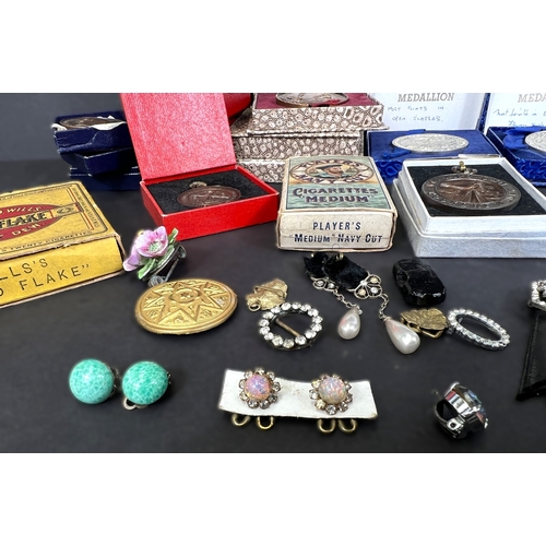 711 - A collection of post war Small holding medals bronze, costume, cigarette cards etc