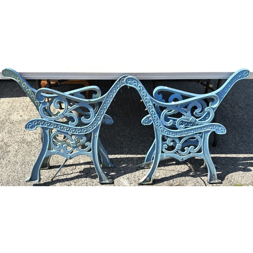 173 - Two pairs of cast iron bench ends.