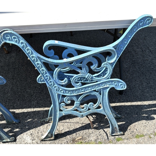 173 - Two pairs of cast iron bench ends.