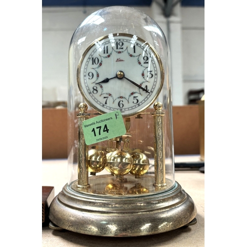 174 - An Edwardian inlaid mantle clock; a 400 day clock.