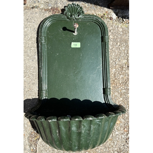 188 - A classical style modern cast metal wall hanging planter and a pair of cast iron bench ends.