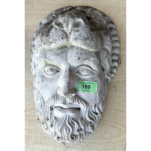 189 - A classical style stoneware wall hanging display head of Hercules and a composition figure and a lar... 