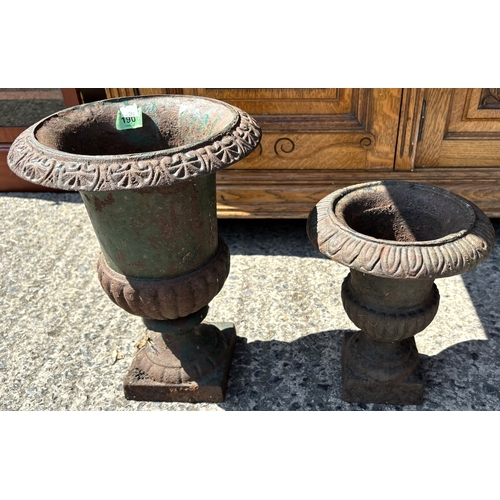 190 - A cast iron classical style garden planter and a similar smaller.