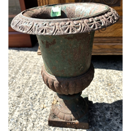 190 - A cast iron classical style garden planter and a similar smaller.