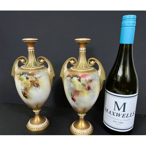 529 - Royal Worcester, a pair of hand painted vases, ovoid with double handles and pedestal, roses on ivor... 