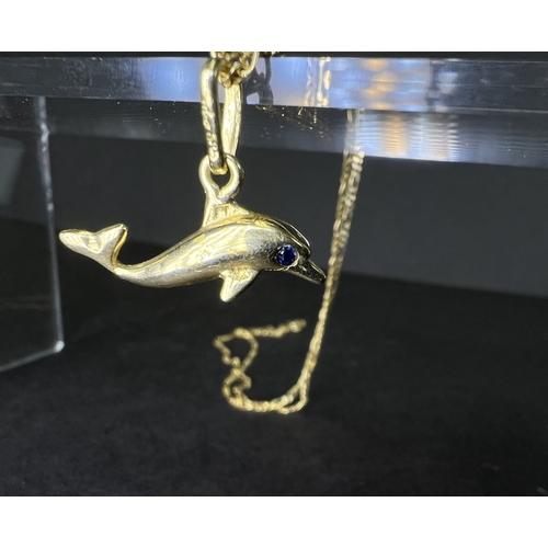 715A - A yellow metal dolphin pendant on necklace, dolphin stamped 585 and necklace stamped Midas 14K gross... 