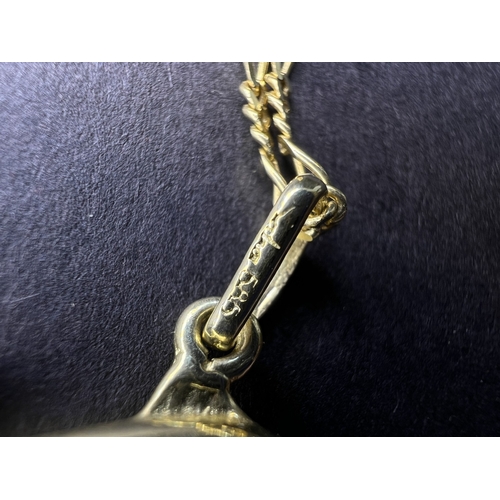 715A - A yellow metal dolphin pendant on necklace, dolphin stamped 585 and necklace stamped Midas 14K gross... 