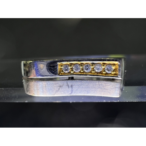 716 - An 18ct white gold wedding band set with four small diamonds, 6.8gms