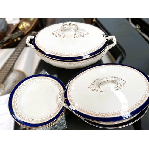 525B - A Victorian dinner service with blue and gilt decoration including tureens, meat platters etc