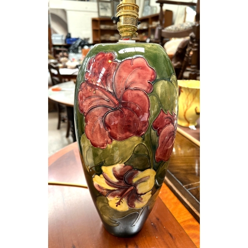 535 - A large Moorcroft Hibiscus lamp, other similar items.