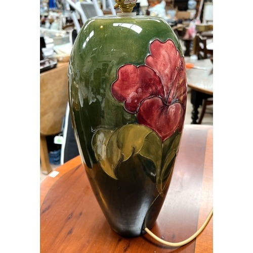 535 - A large Moorcroft Hibiscus lamp, other similar items.