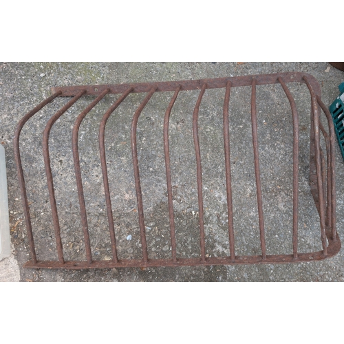 203A - A 19th cast iron wall hanging hay holder