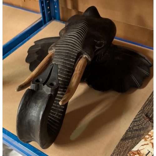 204A - A carved wooden wall hanging elephant head