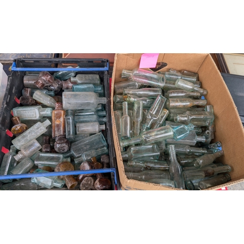 205A - A large collection of vintage advertising, Chemist and other bottles etc