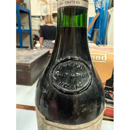 730A - A bottle of Chateau Haut Brion Premier Cru 1975