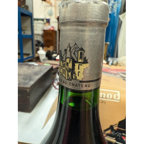 730A - A bottle of Chateau Haut Brion Premier Cru 1975