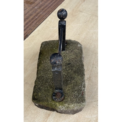 187 - A vintage cast iron door stop in the form of a riding boot; a boot scraper.